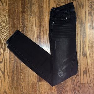 Woman’s distressed jeans